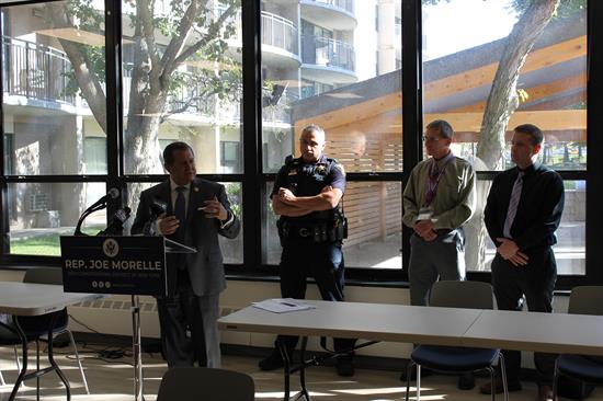 Congressman Morelle speaks with presenters from Lifespan and the Monroe County Sheriff's Department