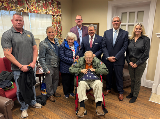 Congressman Morelle presents flag to veteran.