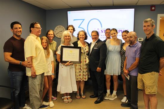 Congressman Morelle stands with Mary Jo Albert and family at the presentation of the Congressional Award of Distinction.