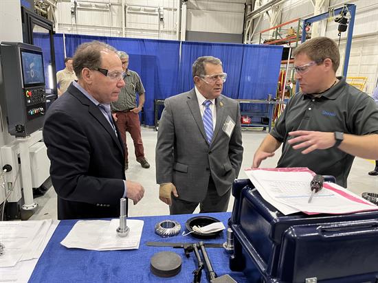 Congressman Morelle looks at tools used at the Gleason Corportation