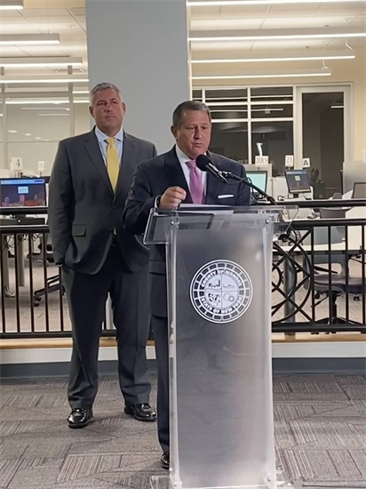 Rep. Morelle speaks at podium, behind him is County Executive Bello