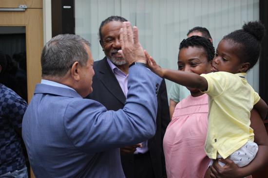 Congressman Morelle high fives a young constituent.