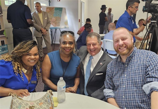 Rep. Morelle poses with community members at the Greenwood Project Event