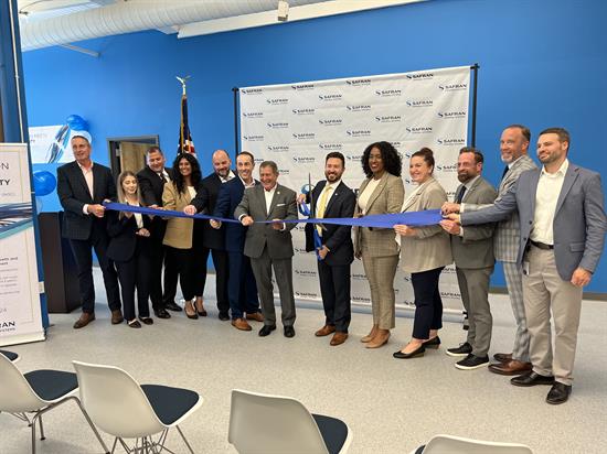 Congressman Morelle helps cut the ribbon at the Safran expansion.