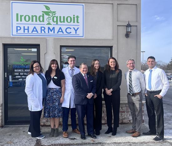 Congressman Morelle stands with staff at the Irondequoit Pharmacy