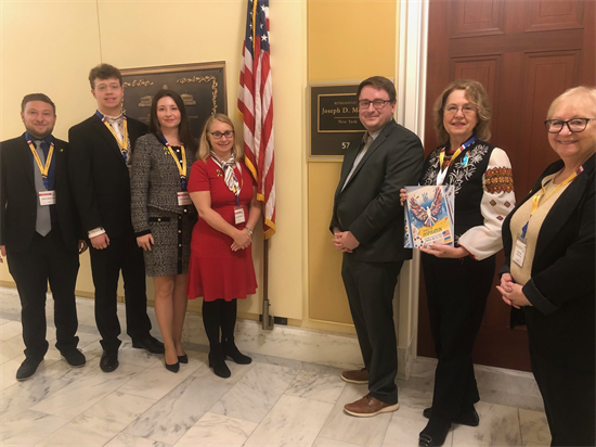 Team Morelle staff stands with members of the local Ukrainian community.