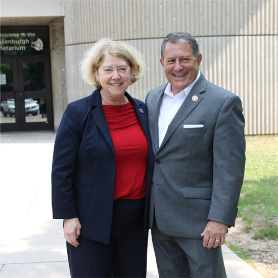 Deputy Melroy and Congressman Morelle stand in front of the planetarium.