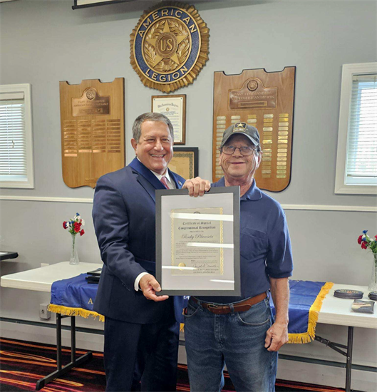 Rep Morelle presents a certificate to a local Vietnam Veteran