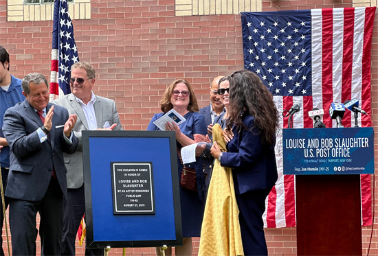 Rep. Morelle stands with local leaders, family members of Louise and Bob Slaughter to unveil the plaque bearing their name