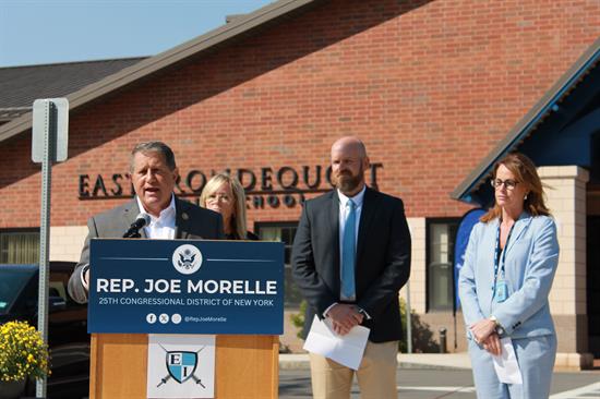 Congressman Morelle stands with school administrators at a press conference.