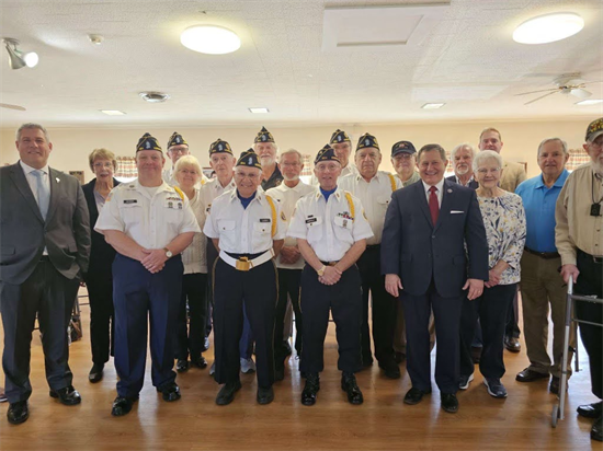 Rep. Morelle stands with local Vietnam War veterans at a pinning ceremony