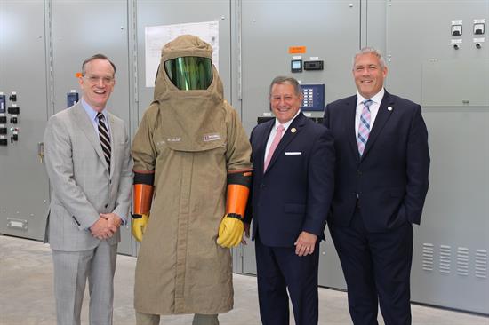 Congressman Morelle stands with leaders at the Monroe County Wastewater Facility