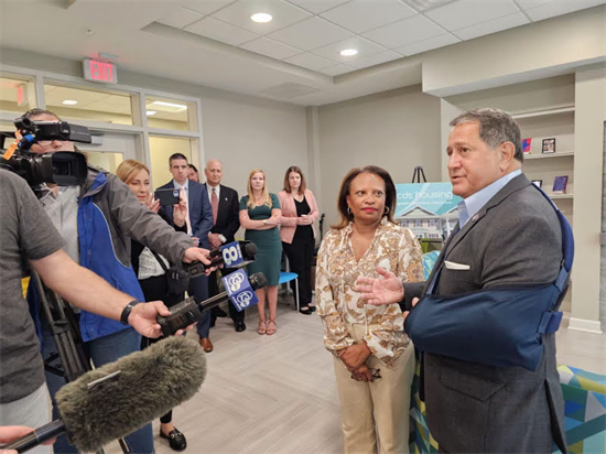 Rep. Morelle stands with Deputy Secretary Todman in front of Rochester media