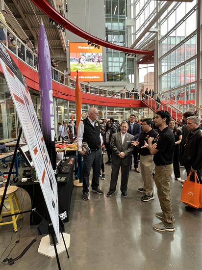 Congressman Morelle watches a presentation by students at the Imagine RIT Festival