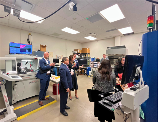 Congressman Morelle stands with EDA visitors at Monroe Community College